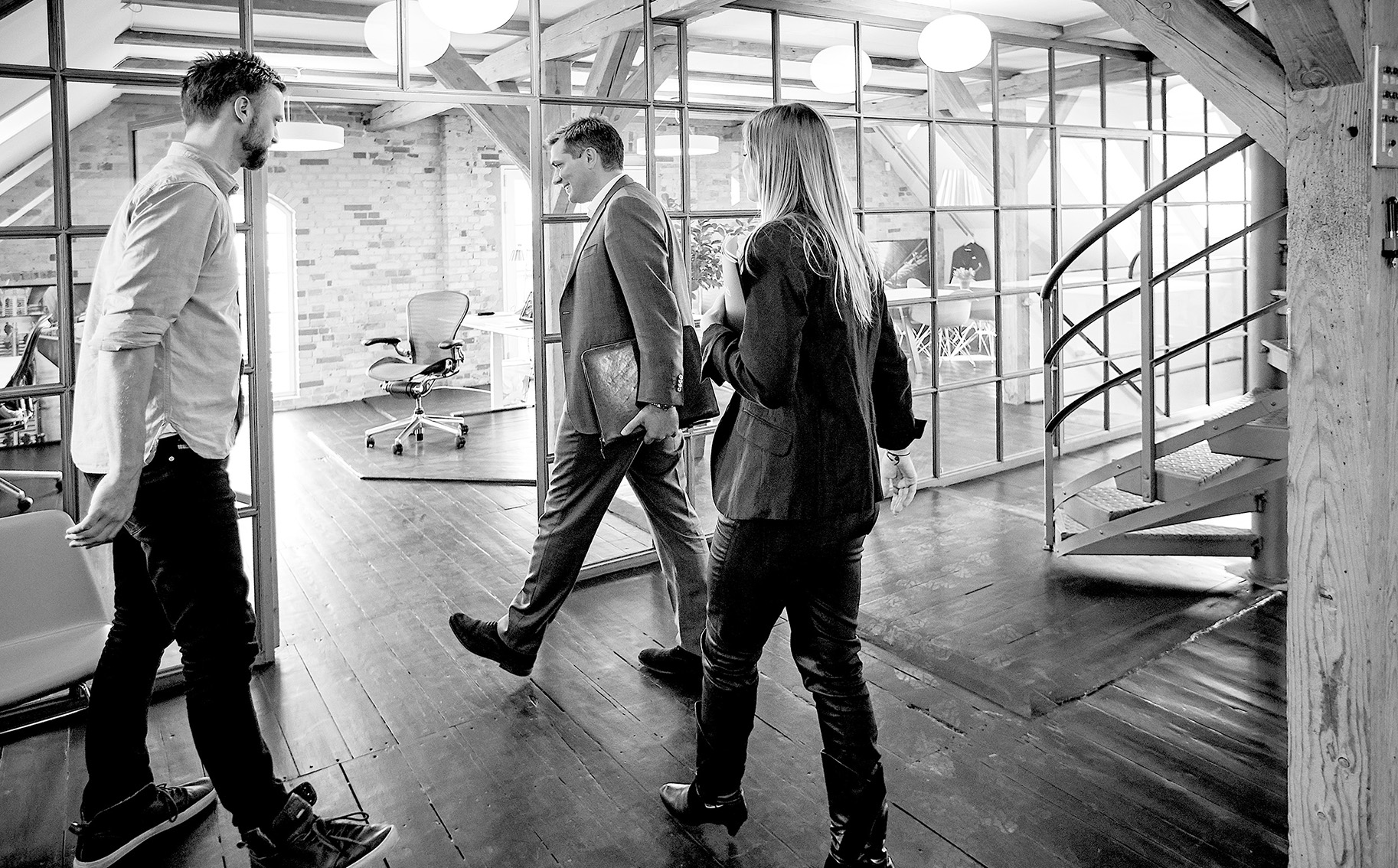 GlobeSearch consultants meeting with a client in a Copenhagen loft office